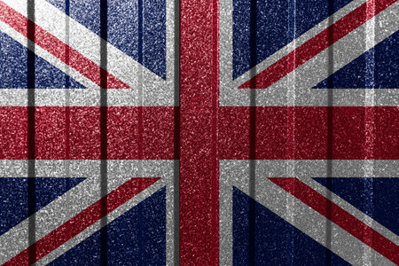Textured flag of United Kingdom on metal wall. Colorful natural abstract geometric background with lines.の写真素材