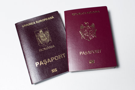 Close-up of Moldavian and Romanian passports isolated on white background.の写真素材