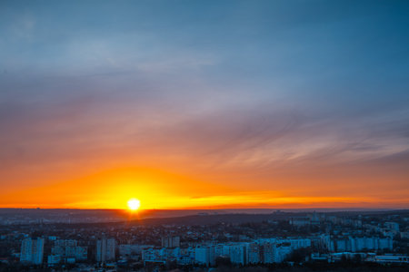 Colourful landscape of beautiful dark sunset or sunrise close to evening above the city. Natural abstract background.の写真素材