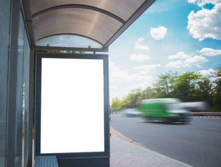 Vertical empty blank billboard mockup on bus station, near highway, asphalting road.の写真素材