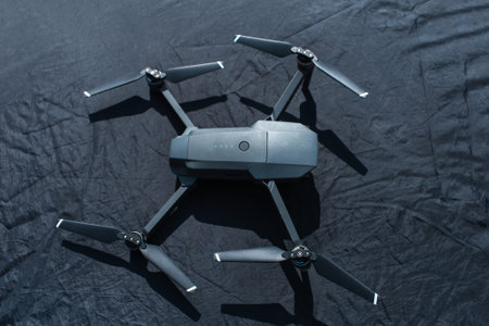 Close-up of modern drone on black helipad.の写真素材