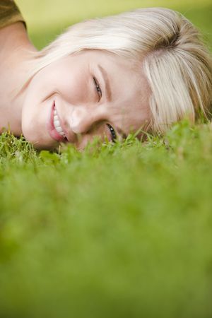 Close-up of a thoughtful young woman resting in the parkの写真素材