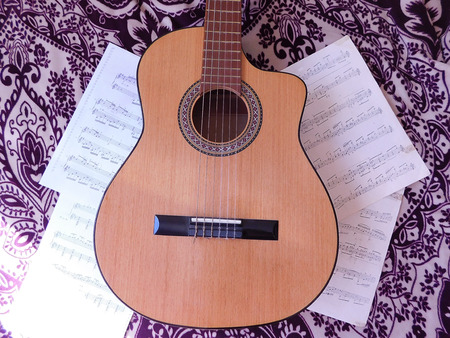 guitar and musical scores on a beautiful backgroundのeditorial素材