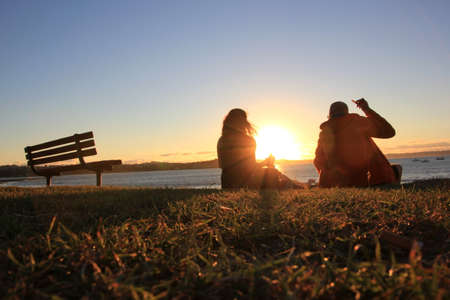 A couple is watching the sunsetの写真素材