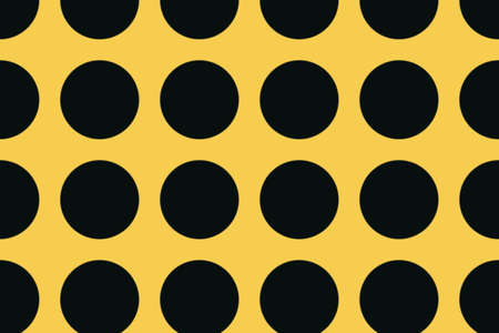 orange background with large black dotsの写真素材