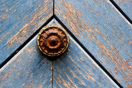 rustic door knob on a weathered doorの写真素材