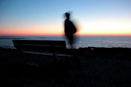 Running man at twilight at the oceanの写真素材