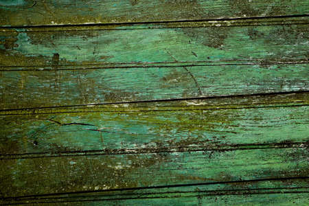 Green weathered wooden planks from a doorの写真素材