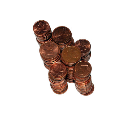 Loose change coins stacks on white background
