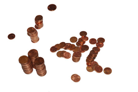 Loose change coins stacks on white background