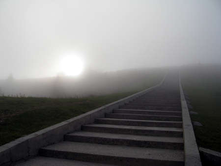 staircase that leads into the unknown, shrouded in fogの写真素材