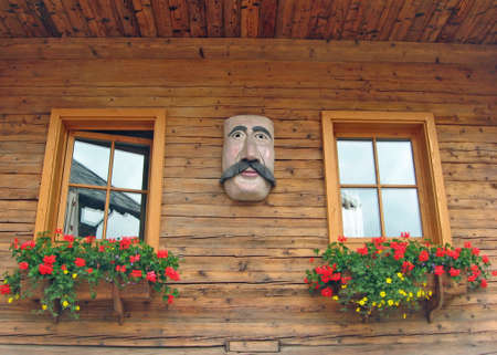 flowered wooden balconies with a mask Tyroleanの写真素材