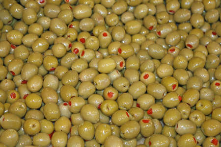 Mediterranean green olives stuffed with tomato in retailの写真素材