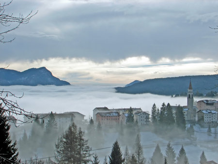 views of remote village in the mountains with thick fog in autumn の写真素材