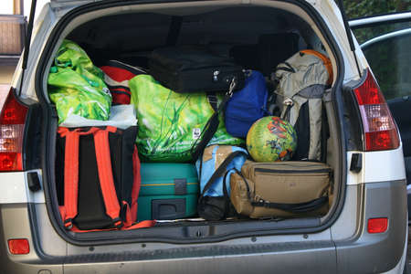very car with the trunk full of luggage ready for the departure of family holidaysのeditorial素材