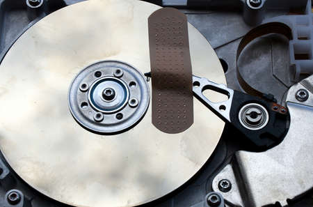 repair of a broken hard disk with a patchの写真素材