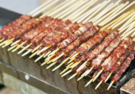 tasty kebabs of lamb and veal cooked grilled on the spitの写真素材