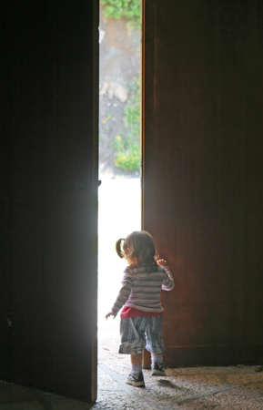 child leaves the door half openのeditorial素材