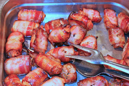 Roulade of bacon and pork in the tray of Italian restauranの写真素材