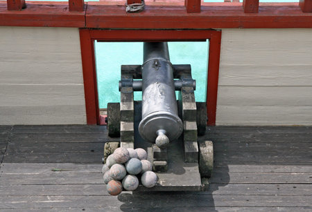 old cannon with balls in a ship of Pirates of the Caribbean
