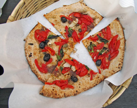 delicious Neapolitan pizza with tomato and mozzarella served in a basket