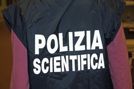 italian scientific policeman with the jacket with reflective writingの写真素材