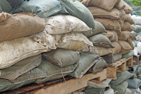 Brown and green sandbags to guard against attacksの写真素材