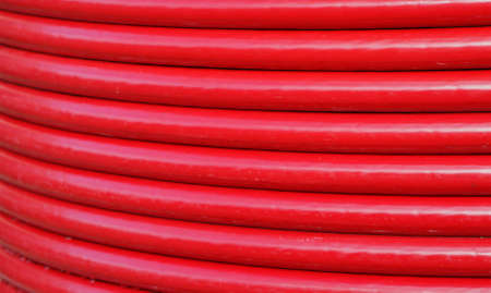 Red turns a voluminous lay cable coilの写真素材