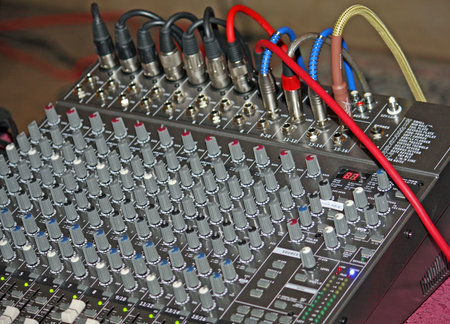 complicated sound mixer to adjust the volume during a concert