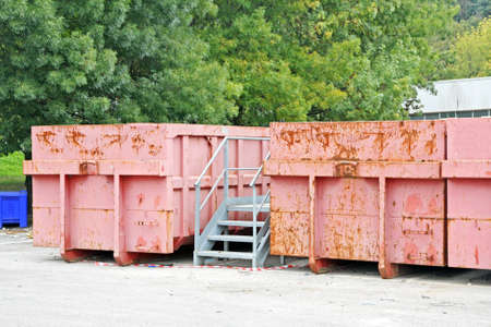 Pink bins for separate waste collection in a city landfillの写真素材