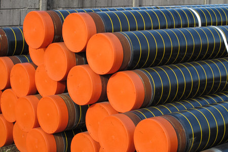 piles of plastic pipes and conduits for transporting water and gas