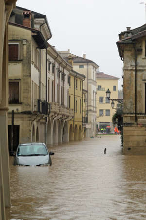 cars in the streets and roads submerged by the mud of the flood after the flooding of the Riverのeditorial素材