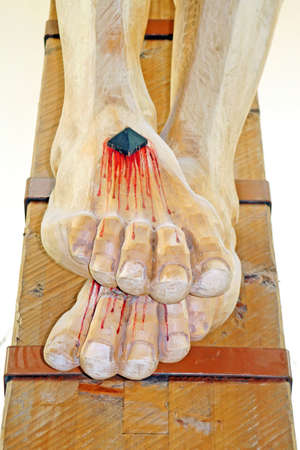 nailed and bleeding feet of Jesus in the chruchの写真素材