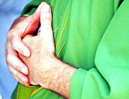 hands clasped in prayer the priestの写真素材