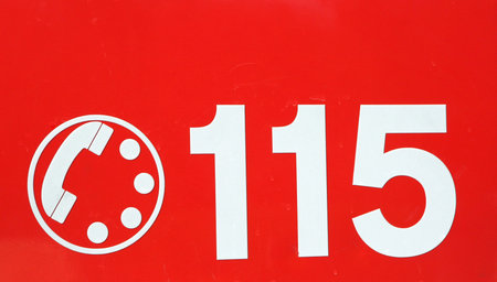 telephone number 115 on red background of the fire brigade in Italy