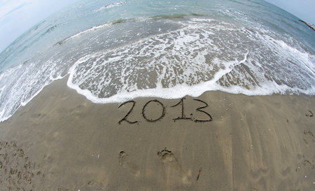waves of the sea on the beach that mark the end of the yearの写真素材