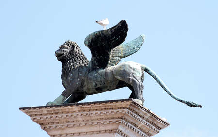 beautiful statue of winged Lion, symbol of the serenissima Republic of Venice in Northern Italyの写真素材