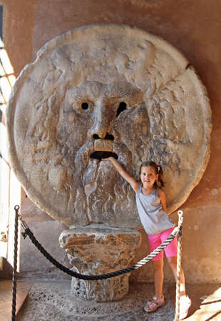 nice young girl puts her hand inside the Bocca della Verità, Rome 4の写真素材