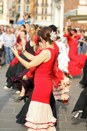 flamenco dancers expert and Spanish dance with elegant costumesの写真素材