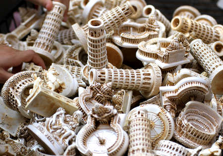thousands of souvenirs and figures of Italy including the Colosseum, the leaning tower of pisa, piazza san pietro on saleの写真素材
