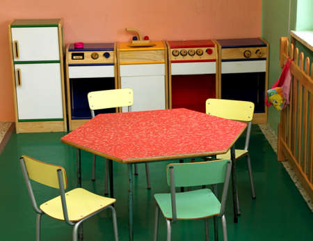 Toy kitchen and table and chairs to play in a nurseryのeditorial素材