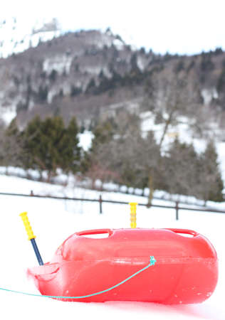 Red bob made of sturdy plastic on white snow for fun rides on the  mountainの写真素材