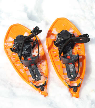 Orange snowshoes for walking on the soft snow on the high mountain in winterの写真素材