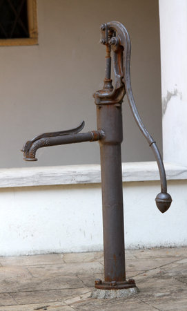 old cast iron fountain in the cloister of the old convent of the friars in Europeの写真素材