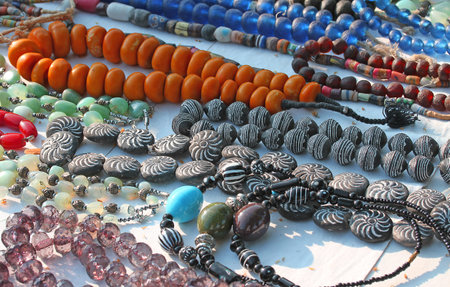 pearl necklaces in antique market in a stand