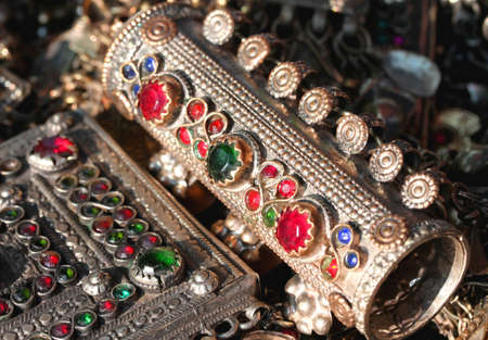 ancient bracelet and various vintage metal jewelry and gemstone at flea marketの写真素材