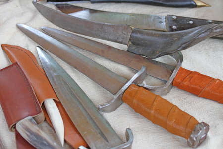 rare collection of antique knives and hunting knives in the medieval styleの写真素材