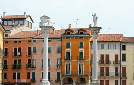 two tall columns in Piazza dei Signori in vicenza with the lion of San Marco and the Redeemer