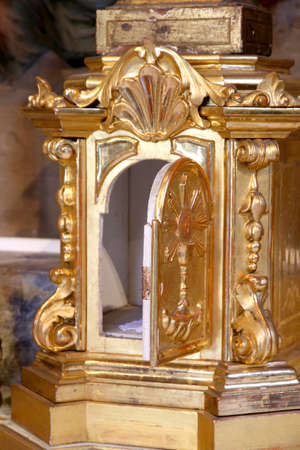 precious gold Tabernacle with door open in a Christian Churchの写真素材