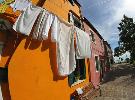 Drying laundry to dry on the ORANGE House in summerの写真素材